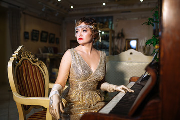 a girl in the image of 20-30 years in the style of gatsby in an evening shiny ash dress with a...
