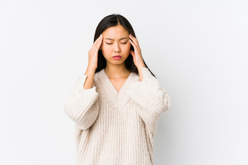 Young chinese woman isolated touching temples and having headache.