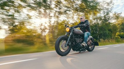 Fototapeta na wymiar motorbike on the road riding. having fun riding the empty road on a motorcycle tour / journey
