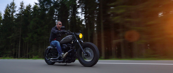 motorbike on the road riding. having fun riding the empty road on a motorcycle tour / journey