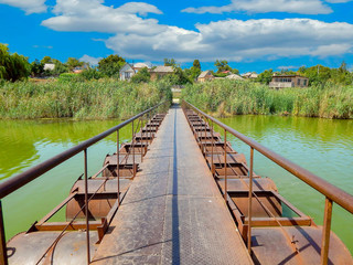 pontoon bridge over the river with blue sky