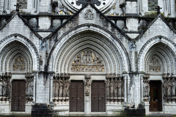 Fototapeta na wymiar Arched entrance of Saint Fin Barre's Cathedral in Cork city, Ireland