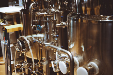 Brewery for production of beer. Alcohol industry business background. Stainless steel equipment for producing beer alcohol drink. Beer production brewery tanks. Beer tanks.