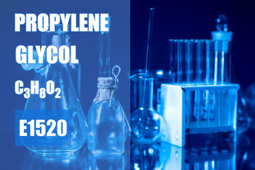 Chemist in a protective suit, glasses and gloves holding test tubes. Testing of potentially hazardous chemical liquids. A man makes an analysis of water samples from the site of contamination.