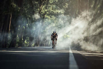 Asian men are cycling road bike in the morning