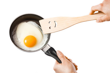 pan in hands on a white background