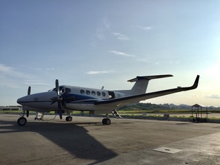 Fototapeta na wymiar Turbo propeller airplane parked in airport yard waiting for passengers