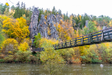 Swing Bridge over Ohre River at Svatos Rocks, Czech: Svatosske skaly, at autumn time, Czech Republic