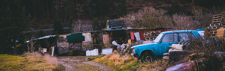 Rusty wrecked car, vintage style, old truck background