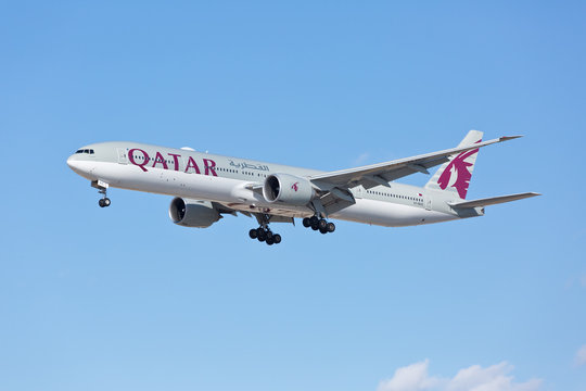Chicago, USA - May 30, 2018: A Boeing 777-300ER aircraft of Qatar Airways landing at the O'Hare International Airport. Qatar Airways is the national airline of Qatar, based in Doha.
