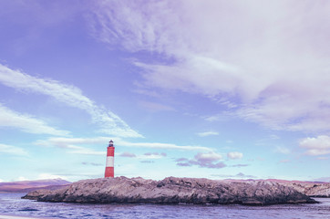 lighthouse on coast of sea faro fin del mundo