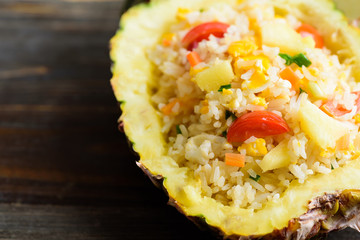 Thai food, pineapple fried rice in pineapple fruit bowl, vegetarian food