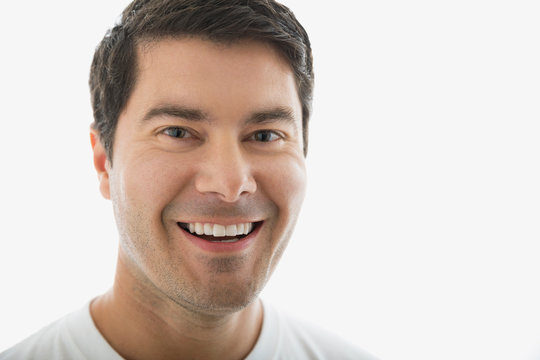 Close up portrait of smiling brunette man