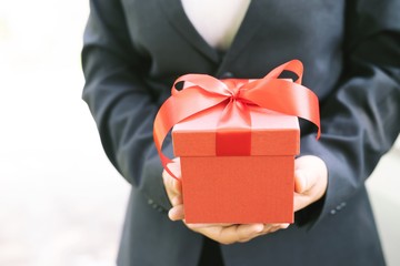 Gift box in hand for lovers on Valentine's Day, New Year, Christmas Day
