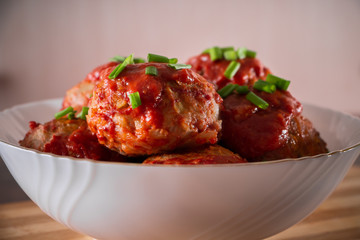 Meat balls with tomato sauce and herbs