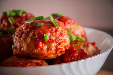 Meat balls with tomato sauce and herbs