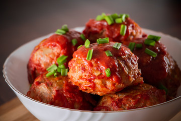 Meat balls with tomato sauce and herbs