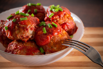 Meat balls with tomato sauce and herbs