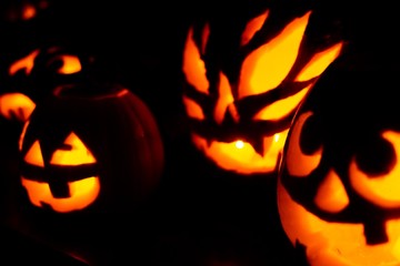 Three Jack-o-Lanterns glowing for Halloween