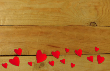 Heart shaped red paper on a wooden background Valentine's Day