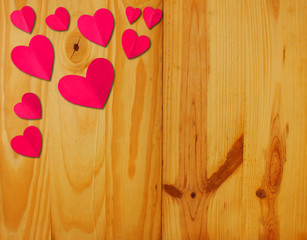 The heart shaped red paper on a wooden background Valentine's Day