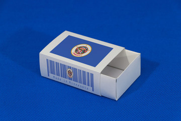 Minnesota flag on white box with barcode and the color of state flag on blue background, paper packaging for put match or products. The concept of export.