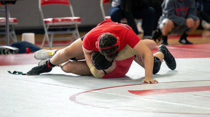 High School wrestlers competing at a wrestling meet