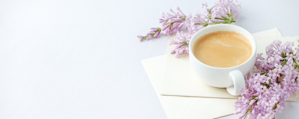 Minimal elegant composition with coffee cup and lilac branches, envelope on white background, female morning breakfast, woman mother day, saint valentine day, wedding - obrazy, fototapety, plakaty
