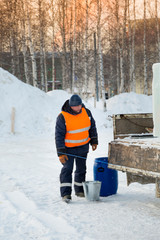 Worker at the assembly site of the ice town