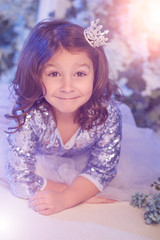 Obraz na płótnie Canvas Cute little girl with flowers
