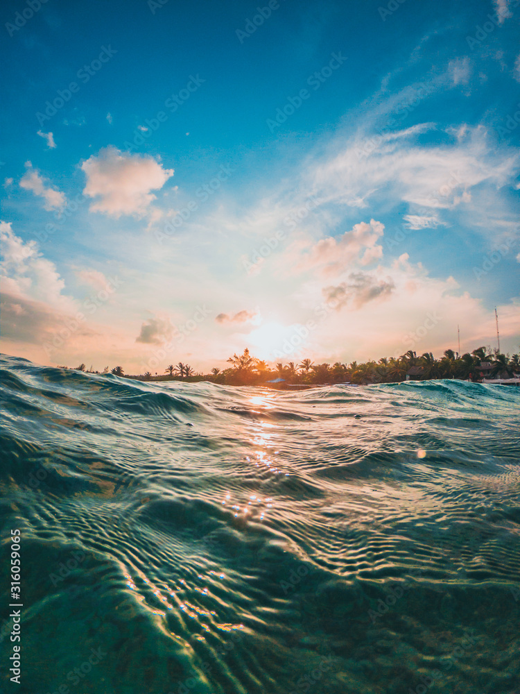 Wall mural sunset in the caribbean sea