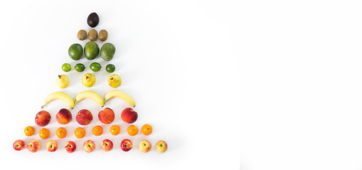 Fruit in the shape of a pyramid on isolated white background