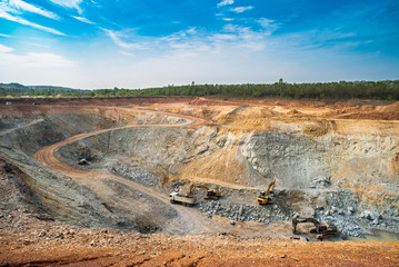 Aerial view of opencast mining quarry with lots of machinery at work - view from above.This area has been mined for copper, silver, gold, and other minerals,Thailand