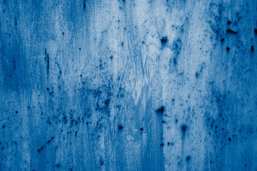 Obraz premium Multicolored peeling wall texture and background. Surface with brush strokes, stains. The colors like used by the Impressionists. toned in classic blue trendy color of the year 2020