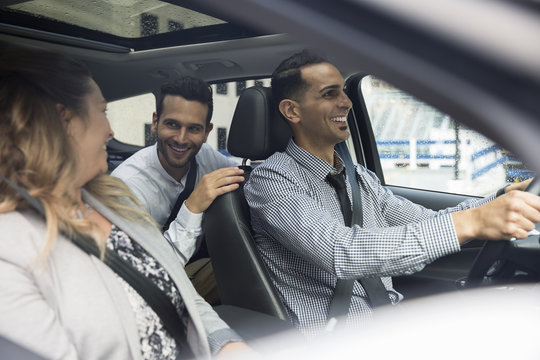 Business people carpooling in car