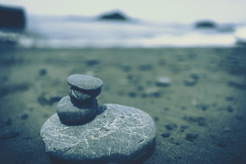 Zen rocks on a sandy beach