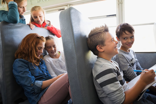 School kids riding school bus