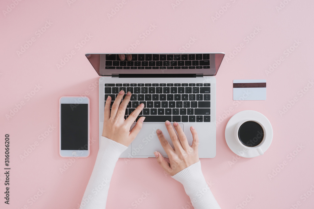 Aufkleber human using laptop top view on minimal workspace. color background and copy space.