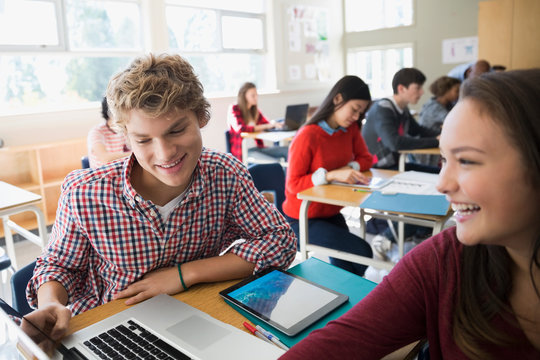 High School Students Using Laptop In Classroom