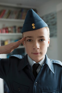 Portrait Boy Saluting In Cadet Uniform