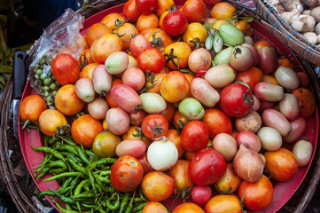 Various of fresh organic vegetables, tomatoes, chili and onion in market