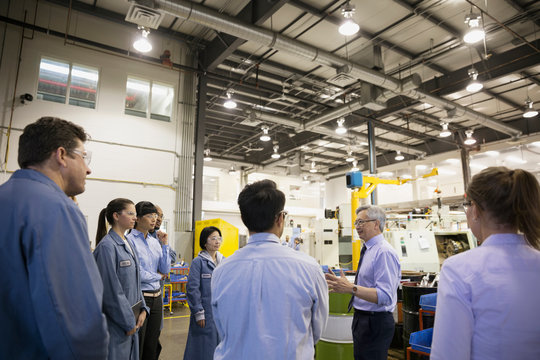 Manager Leading Team Meeting In Factory