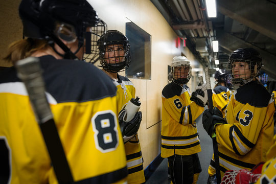 Womens Ice Hockey Team Talking Outside Locker Room