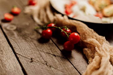 Italian Buratto cheese, delicious cheese, appetizer of cheese, cherry and arugula, cheese dish