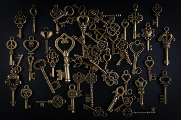 Bronze keys on black background antique key still life