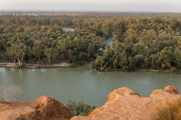 Scenic view to Murray River from rugged cliff top at Murtho lookout in Riverland. Natural South Australian waterfront scenery in Riverland at sunset