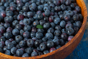 fresh blueberries in a wooden bowl