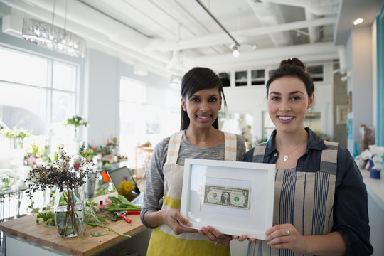 Portrait Confident Florists Holding Framed First Earned Dollar