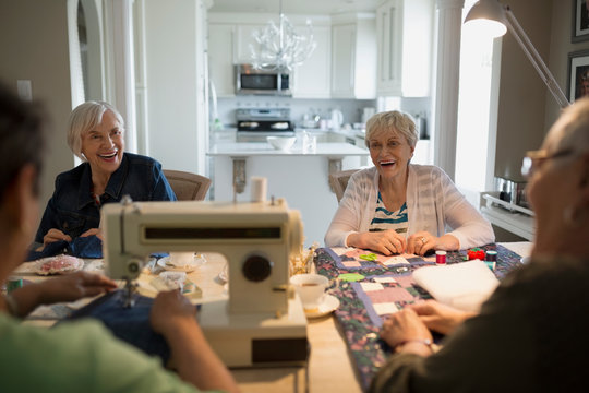 Senior Women Quilting At Table