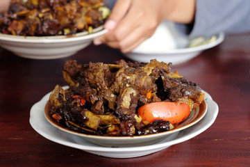 Tengkleng Kambing Pak manto, Solo, Central Java, Indonesia. Traditional Indonesian spicy food made from the bones of goat.